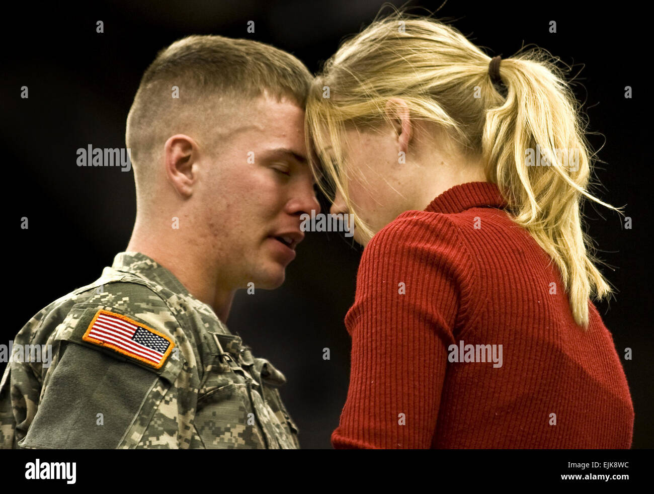 U.S. Army Spc. Christopher Ruppel, of the 76th Infantry Brigade Combat Team, says goodbye to Sammy Fischer prior to the start of the brigade's departure ceremony at the RCA Dome in Indianapolis, Ind., Jan. 2, 2008. With more than 3,400 Soldiers from approximately 30 Indiana communities deploying for a 12-month tour in Iraq, this is the largest Indiana National Guard deployment since World War II.  Capt. Greg Lundenberg Stock Photo