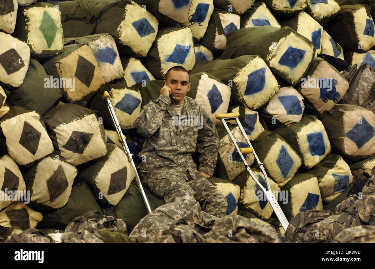 U.S. Army Spc. Maximo Delacruz, of the 76th Brigade Combat Team, sits out during a going away ceremony Jan. 2, 2008, at the RCA Dome in Indianapolis, Ind. The Indiana National Guard is preparing to deploy its largest amount of Soldiers since World War II with more than 3,400 Soldiers scheduled to depart for Iraq to serve during their 12-month rotation.  Staff Sgt. Russell Klika Stock Photo