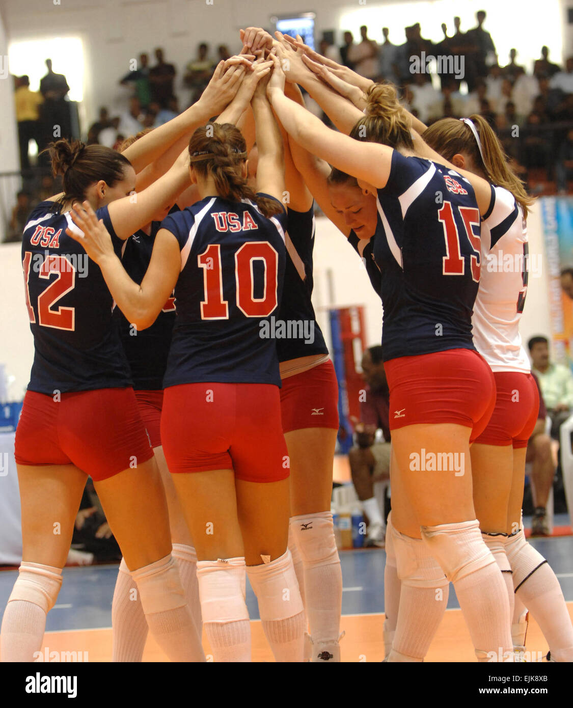 India 18 Oct. 2007 - The U.S. Womens Volleyball team huddles together during a match against the Netherlands at the 4th Conseil Internationale du Sport Militaire’s CISM Military World Games in Hyderabad, India.  The U.S. went on to win in three games, 25-14, 25-16, 25-18.  The Conseil Internationale du Sport Militaire’s CISM Military World Games is the largest international military Olympic-style event in the world. In this year’s fourth edition of the Games, 103 countries and more than 5,000 athletes are scheduled to compete Oct. 14-21 in boxing, diving, football soccer, handball, judo, milit Stock Photo