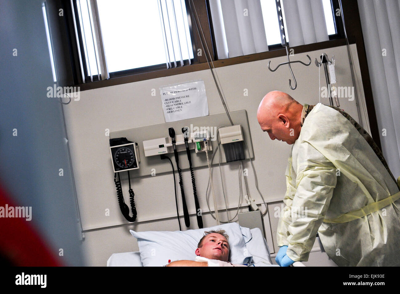 U.S. Army Chief of Staff Gen. Raymond T. Odierno meets a patient inside the intensive-care unit on Landstuhl Regional Medical Center in Landstuhl, Germany during a visit Dec. 19, 2011.  Staff Sgt. Teddy Wade Stock Photo