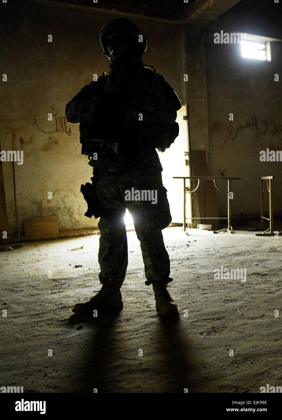 U.S. Army Spc. Jason Edwards, of 982nd Combat Camera Company Airborne, stands silhouetted during a convoy in Baqubah, Iraq, Aug. 10, 2007. The Soldiers are conducting operations in the city to capture insurgents and locate weapons caches.  Staff Sgt. Shawn Weismiller Stock Photo