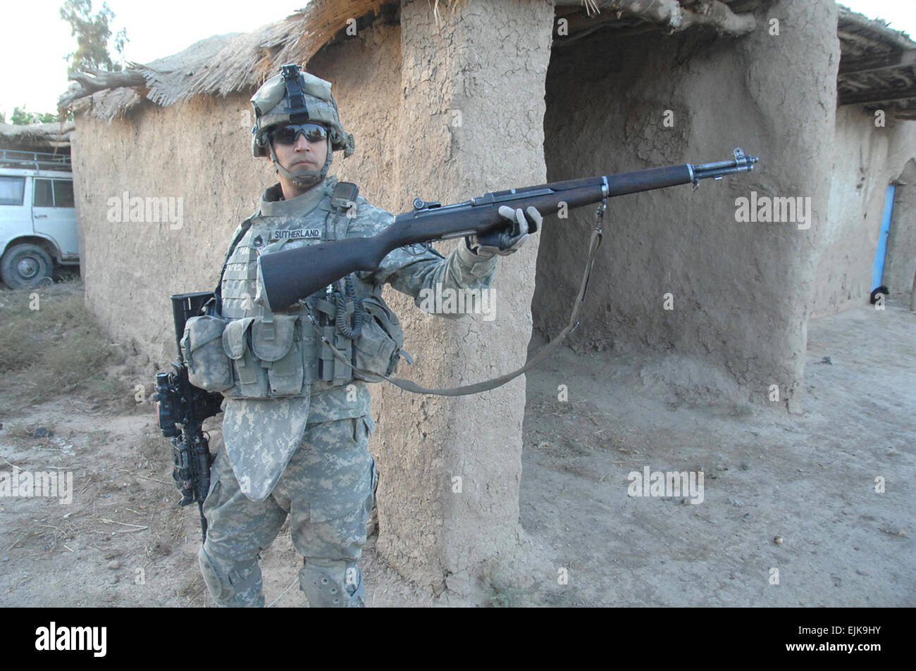 A U.S. Army Soldier displays an M-1 rifle discovered in a suspected insurgent's home in Western Muqdadiyah, Iraq, Dec. 12, 2007. The Soldier is from Alpha Company, 2nd Battalion, 23rd Infantry Regiment, 3rd Brigade Combat Team, 2nd Infantry Division.  Spc. Shawn M. Cassatt Stock Photo