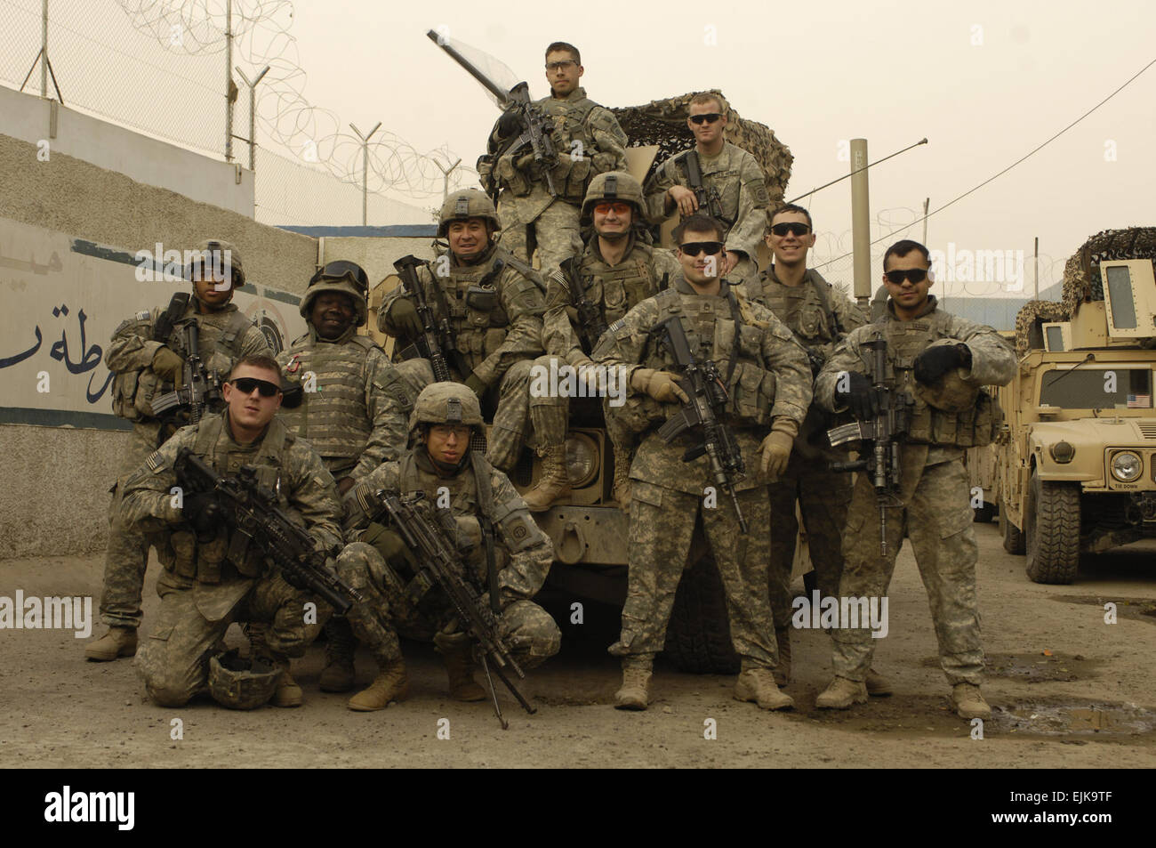 U.S. Army Soldiers assigned to weapons squad, 1st Platoon, Charlie Company, 1st Battalion, 504th Parachute Infantry Regiment pose for a photo before patrolling Rusafa, Baghdad, Iraq, Feb. 18, 2008.  Staff Sgt. Jason T. Bailey Released Stock Photo