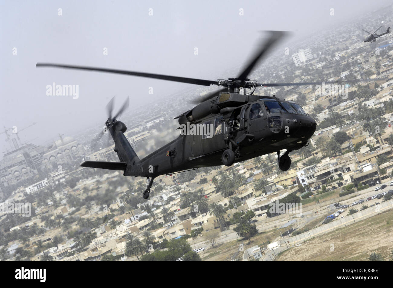 Secretary of Defense Robert M. Gates flies in an UH-60 Black Hawk helicopter over Baghdad, Iraq, to meet with senior Iraqi government officials to urge them to speed up national reconciliation among the country's various factions April 20, 2007.   Cherie A. Thurlby. Stock Photo