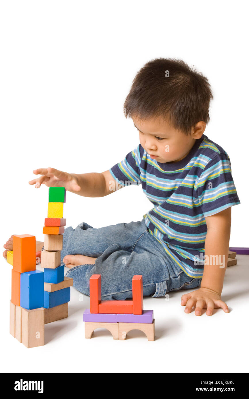 Asian preschooler playing with wooden blocks Stock Photo - Alamy