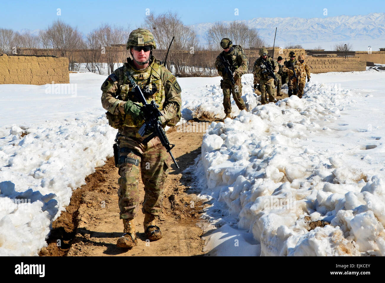 Capt. Patrick Foley front, a member of the Minnesota Army National Guard, Sgt. Brent Crutchfield and Sgt. Craig McComsey, both members of the Mississippi Army National Guard, leave the village of Haji Sultan, Afghanistan, after conducting a joint assessment. Stock Photo