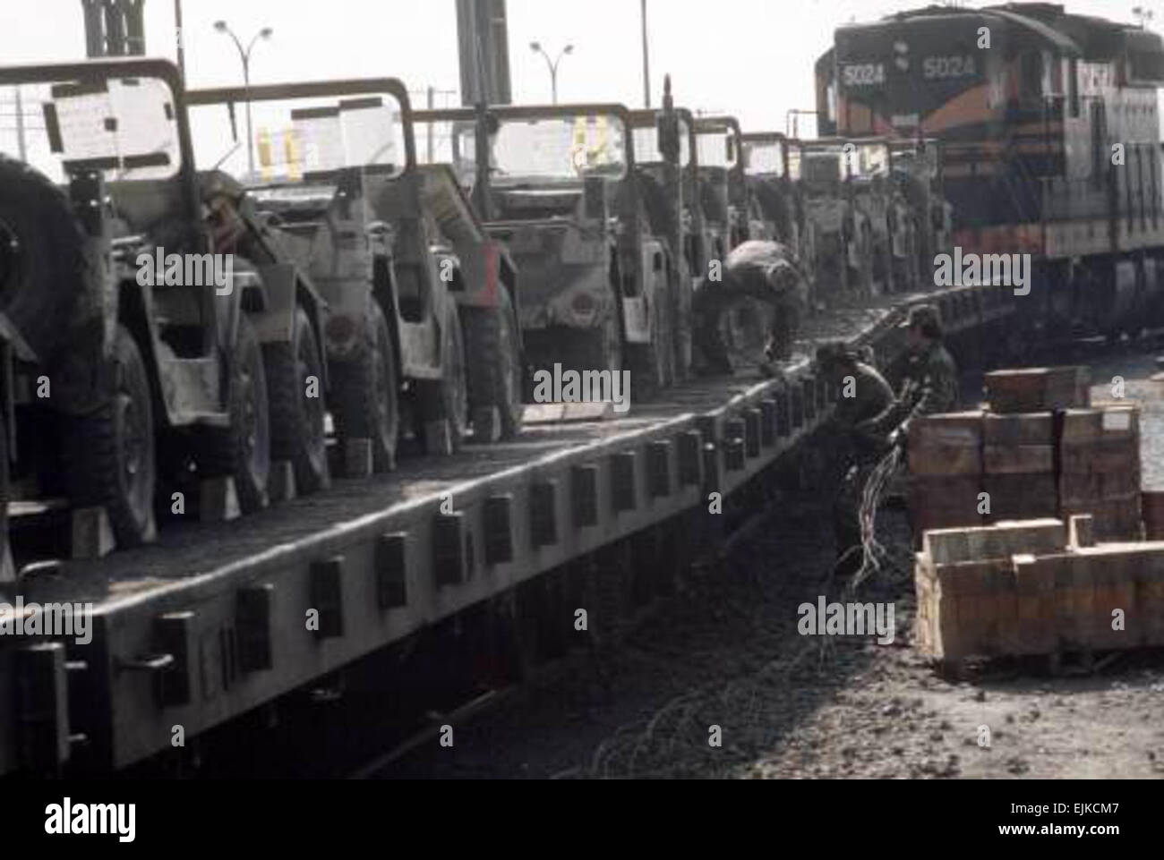 M151 light utility vehicles are tied down to railroad flatcars for shipment to the port at Pusan at the conclusion of the joint US/South Korean Exercise TEAM SPIRIT '87., Official : SSG ARNOLD W. KALMANSON, , PYONG TAEK, , REPUBLIC OF KOREA KOR  Operation: TEAM SPIRIT '87 Entered in system: 08/04/2006  Photographer: SSG ARNOLD W. KALMANSON  VIRIN: DA-ST-87-13012 Stock Photo