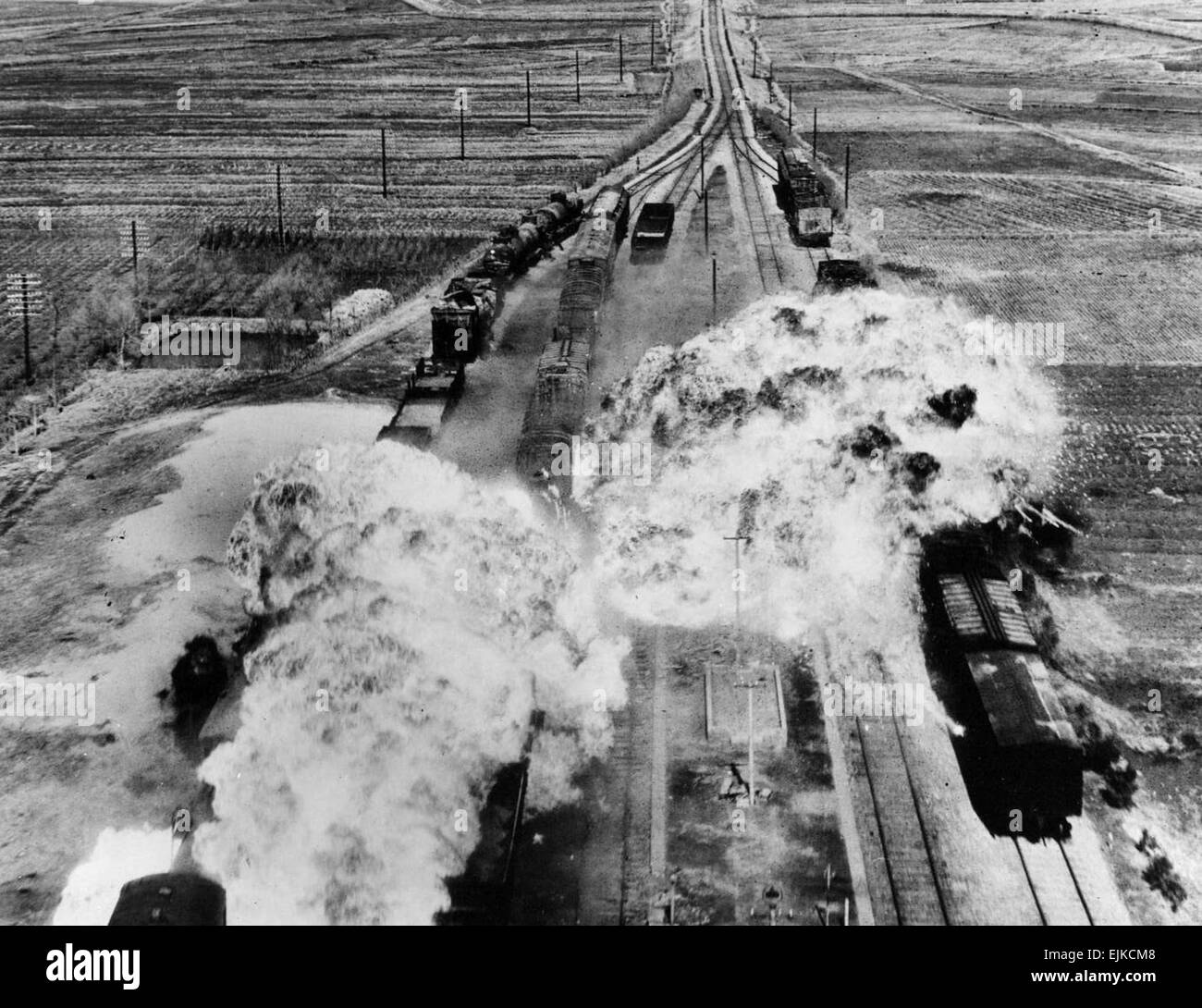 Korean War railroad attack  USAMHI August 19, 2007  While the military kept America's railroads running under Truman, it sought the opposite elsewhere. Here, the Fifth Air Force's 452nd Light Bomb Wing drops napalm on rail cars south of Wonsan, North Korea, an east coast port city, circa 1950-51. Stock Photo