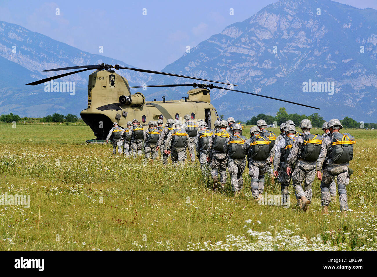 U.S. Army paratroopers load up into a CH-47 Chinook helicopter before a joint parachute training jump near the city of Pordenone in northeast Italy, July 16, 2013. Paratroopers from the 173rd Airborne Brigade Combat Team participated in a joint parachute training jump with CH-47 Chinook aircraft from the 12th Combat Aviation Brigade.  Barbara Romano Stock Photo