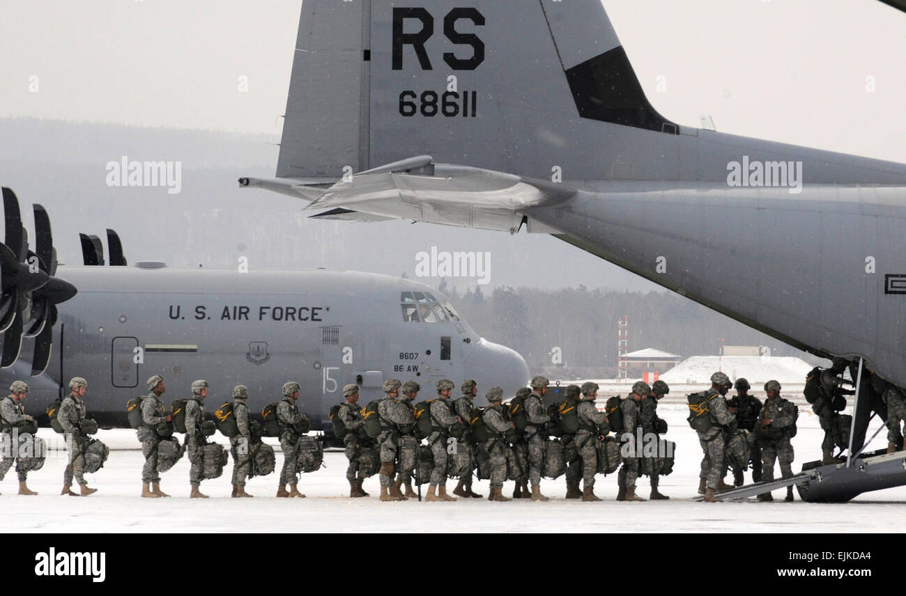 U.S. Army paratroopers from the 173rd Airborne Brigade Combat Team, from Vicenza, Italy, file into a C-130J Super Hercules at Ramstein Air Base, Germany, on Feb. 10, 2012.  More than 300 paratroopers were dropped to commemorate 70 years of combat airlift abilities of the 37th Airlift Squadron from Ramstein Air Base.   Airman 1st Class Trevor Rhynes, U.S. Air Force.  Released Stock Photo