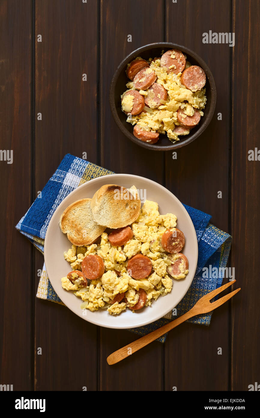 Overhead shot of scrambled eggs made with chorizo slices and onion on