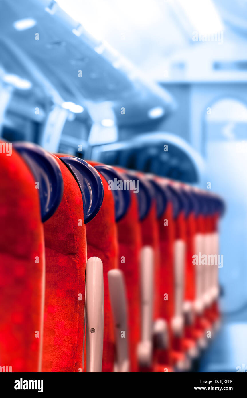 Empty Train Seats in a row - Light blue background Stock Photo