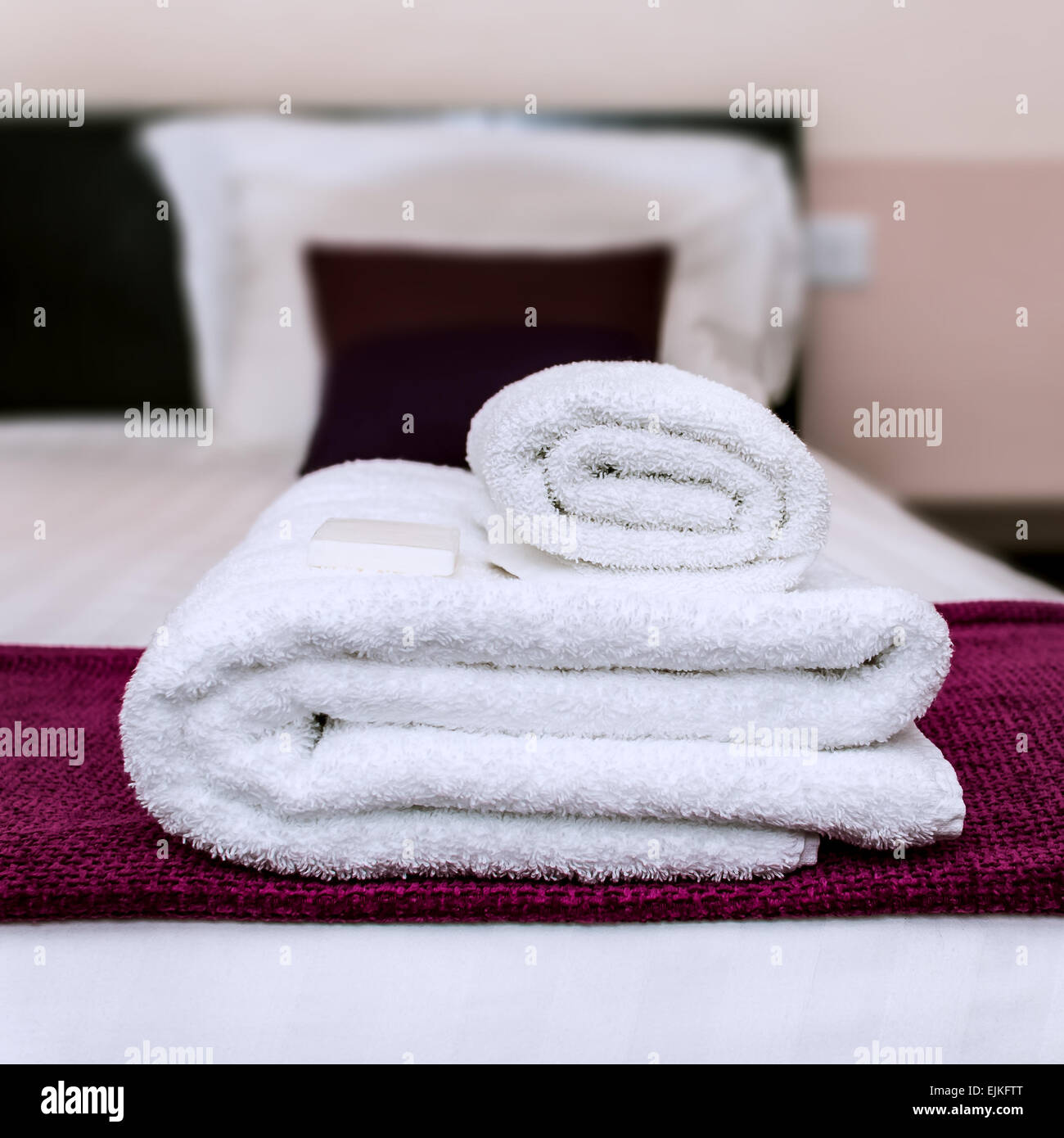 Closeup clean towels and soap in hotel room Stock Photo Alamy
