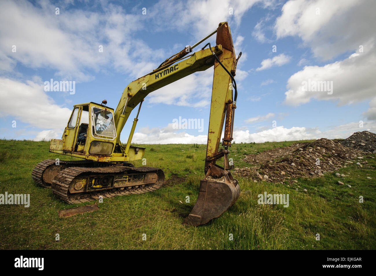 Hymac 580 tracked excavator digger in a rural farm field Stock Photo