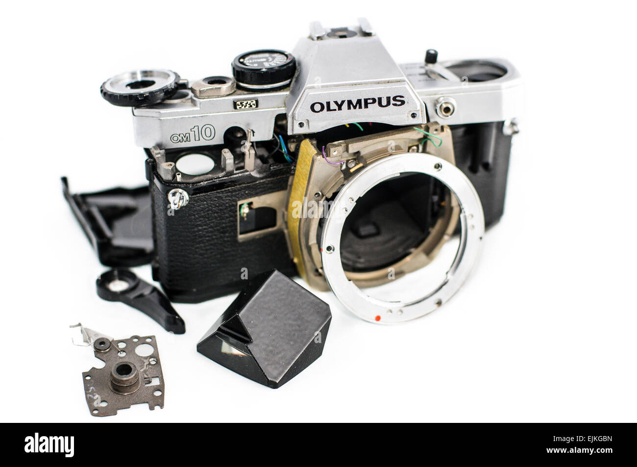 Olympus OM-10 35mm SLR camera in pieces, broken, and in need of repair Stock Photo