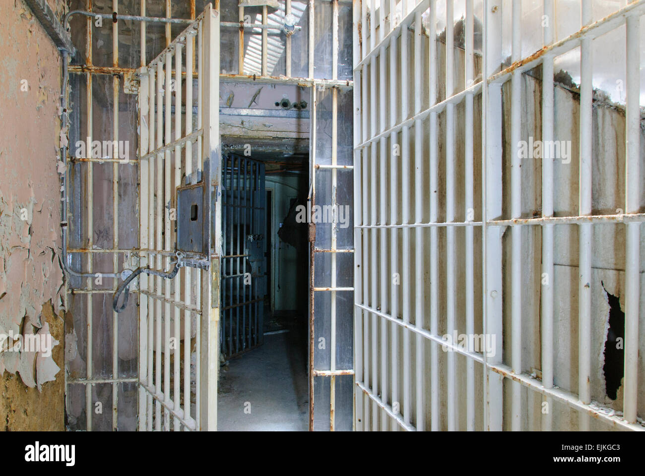 Open metal barred gates inside an old prison Stock Photo