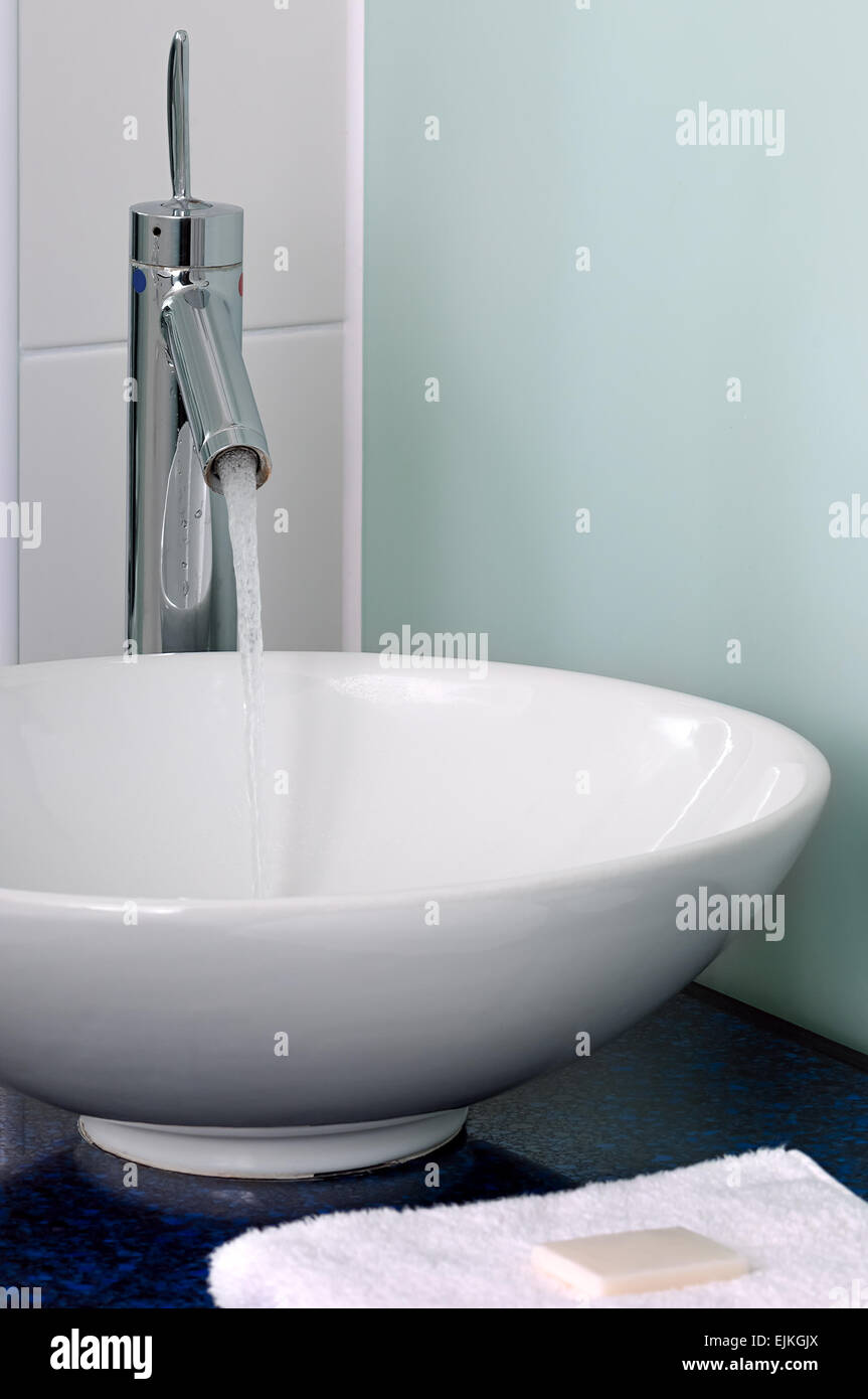 Bathroom sink bowl counter tap mixer towel soap Stock Photo