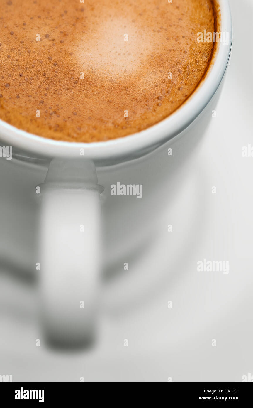 Macro close up studio shot of a half cup of espresso coffee Stock Photo