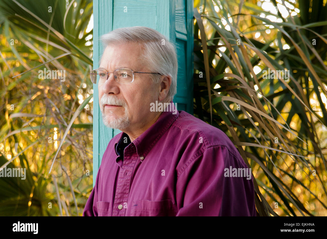 Senior man in his 60s looking into the distance Stock Photo