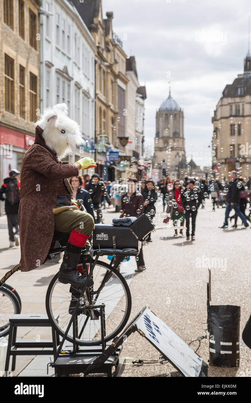 Oxford, UK. 27th Mar, 2015. A street artist blows bubbles which are enjoyed by people passing by on Cornmarket Street, Oxford, Credit:  CBCK-Christine/Alamy Live News Stock Photo