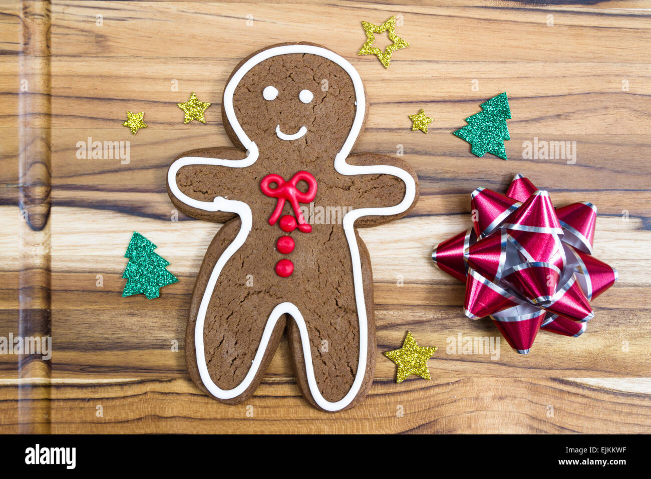 holiday classic, a gingerbread man cookie on a wooden table Stock Photo