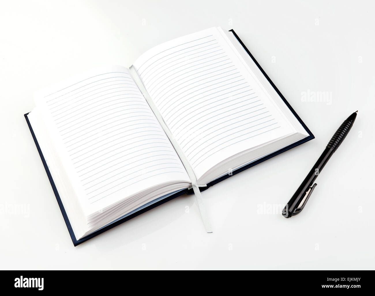 Open notebook with pen Stock Photo