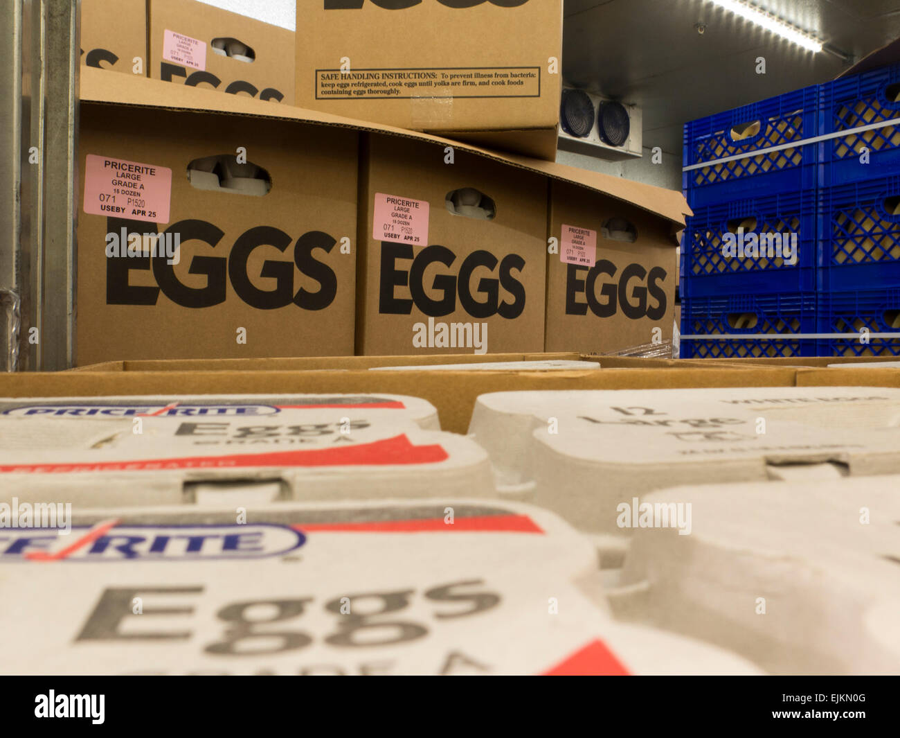 Eggs are stored in a cooler  in a warehouse-style supermarket.. Stock Photo
