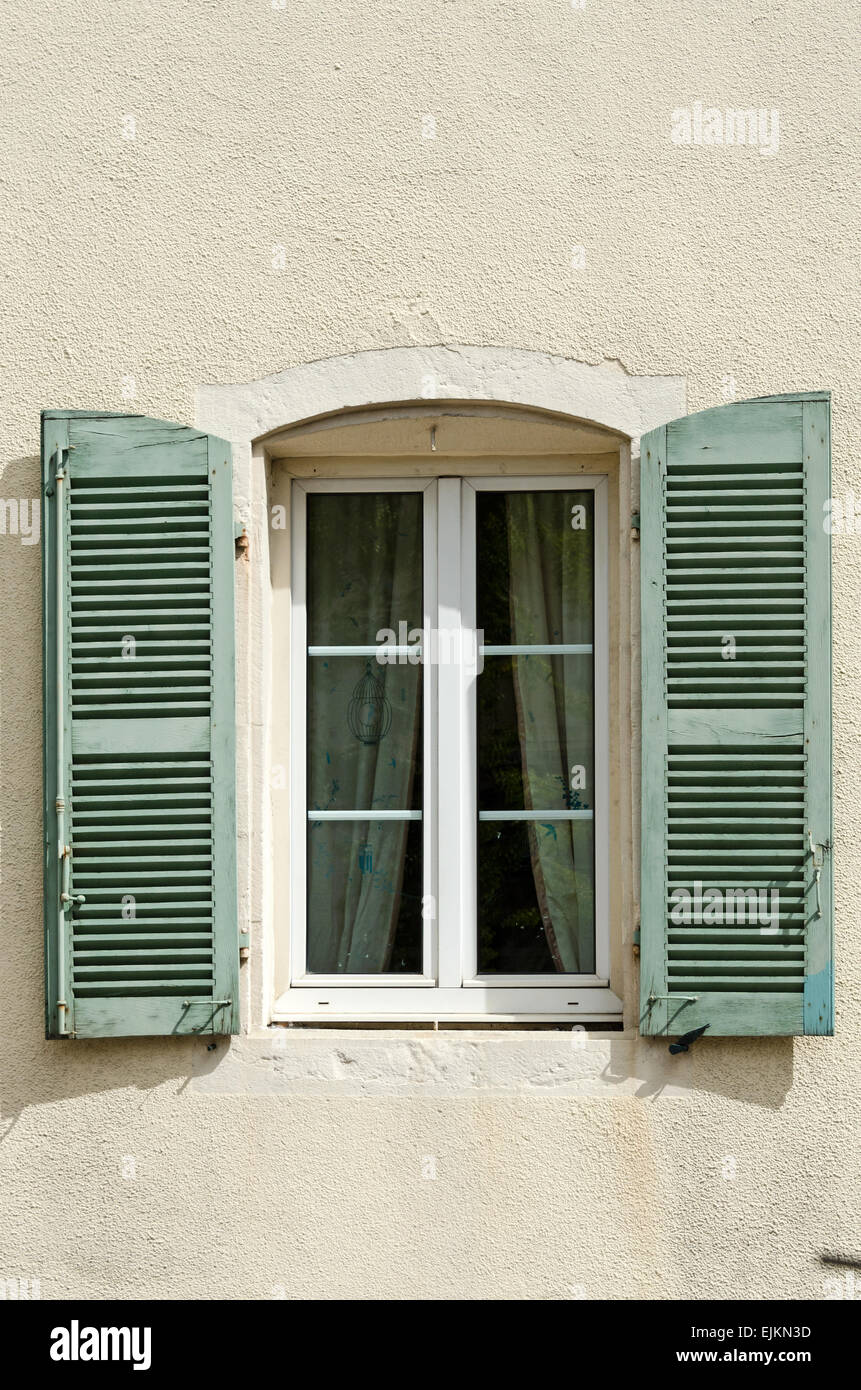 A pretty green and yellow window in the town of Chagny, Saone et Loire, Burgundy, France. Stock Photo