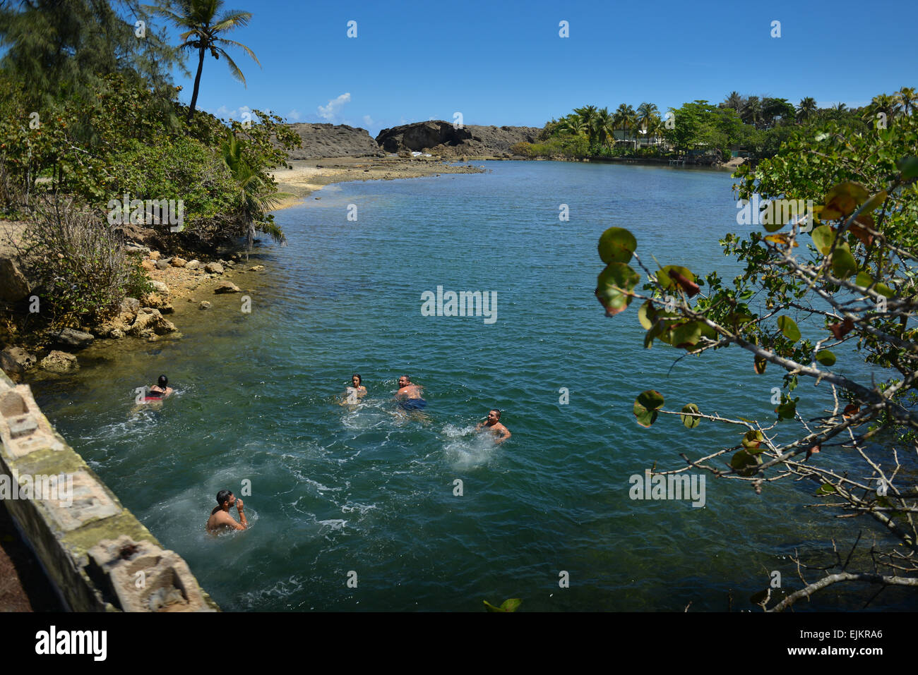 Young adults enjoying the natural pool at Punta Palmas Altas