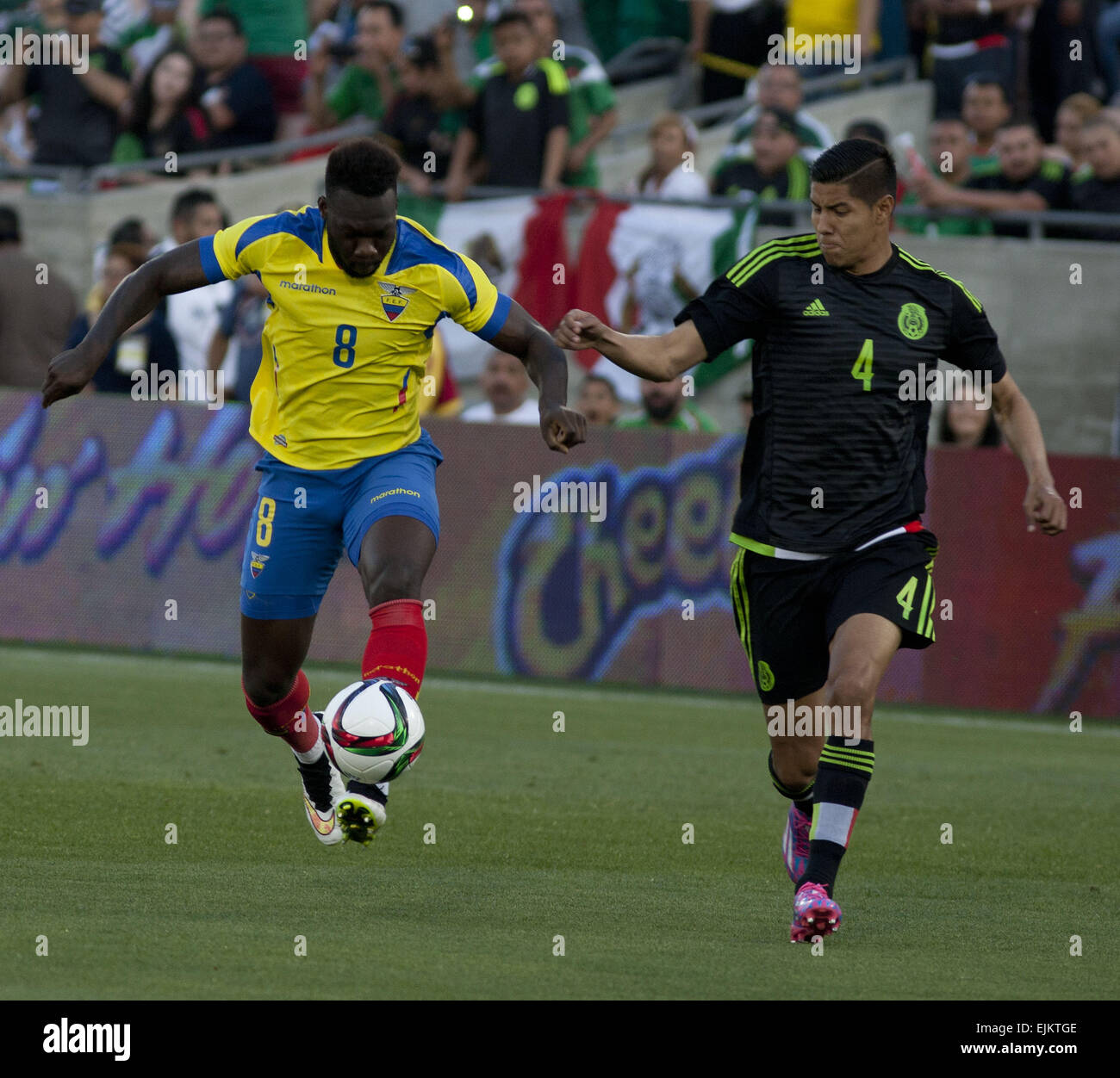 Los Angeles, CALIFORNIA, UNITED STATES OF AMERICA, USA. 28th Mar, 2015. Mexican player (4) Hugo Ayala fights for the ball with Ecuadorian player Felipe Caicedo during thee first half of their game at the Los Angeles Memorial Coliseum for the friendly game today Saturday 28 March 2015.ARMANDO ARORIZO © Armando Arorizo/Prensa Internacional/ZUMA Wire/Alamy Live News Stock Photo