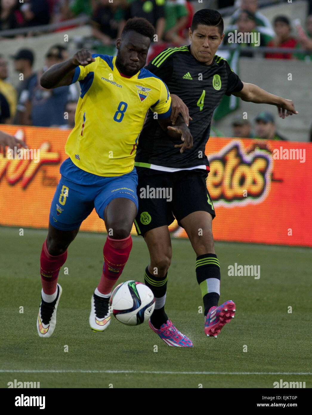 Los Angeles, CALIFORNIA, UNITED STATES OF AMERICA, USA. 28th Mar, 2015. Mexican player (4) Hugo Ayala fights for the ball with Ecuadorian player Felipe Caicedo during thee first half of their game at the Los Angeles Memorial Coliseum for the friendly game today Saturday 28 March 2015.ARMANDO ARORIZO © Armando Arorizo/Prensa Internacional/ZUMA Wire/Alamy Live News Stock Photo