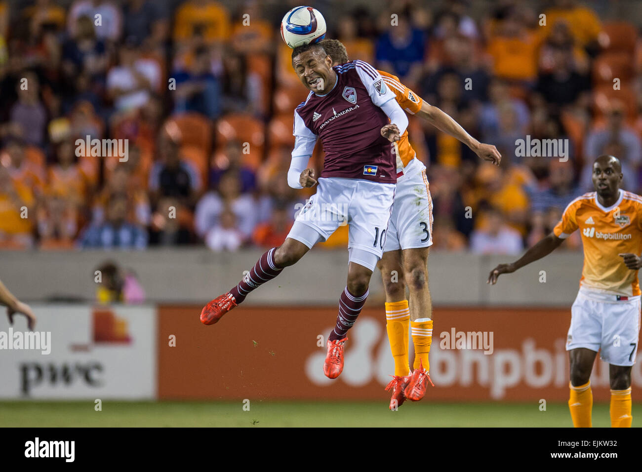 Houston, Texas, USA. 28th Mar, 2015. Colorado Rapids forward Gabriel Torres (10) heads the ball in front of Houston Dynamo midfielder Rob Lovejoy (3) during an MLS game between the Houston Dynamo and the Colorado Rapids at BBVA Compass Stadium in Houston, TX on March 28th, 2015. The game ended in a 0-0 draw. Credit:  Trask Smith/ZUMA Wire/Alamy Live News Stock Photo