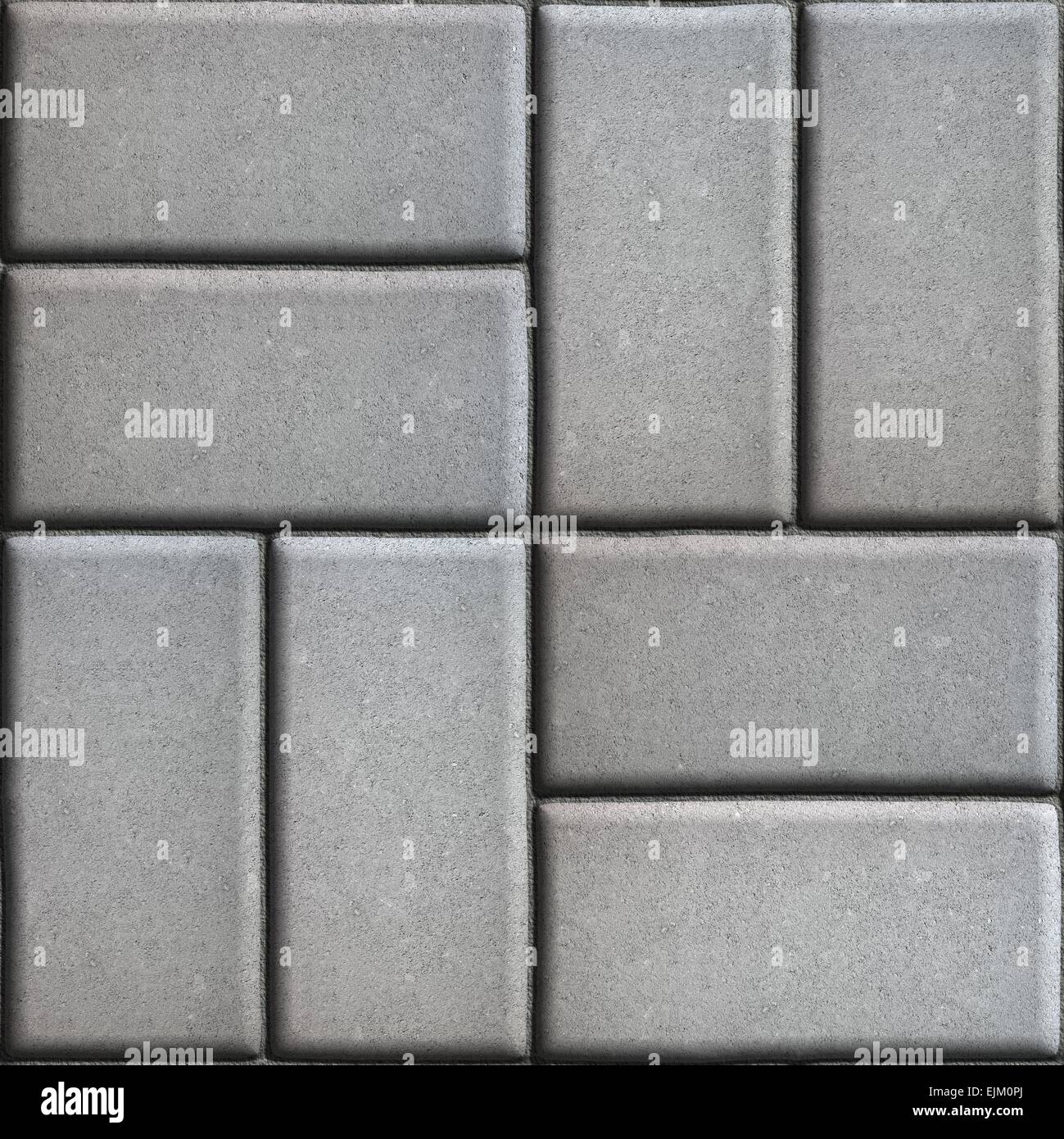 Gray Paving Slabs of Rectangles Laid Out on Two Pieces Perpendicular to Each Other. Stock Photo