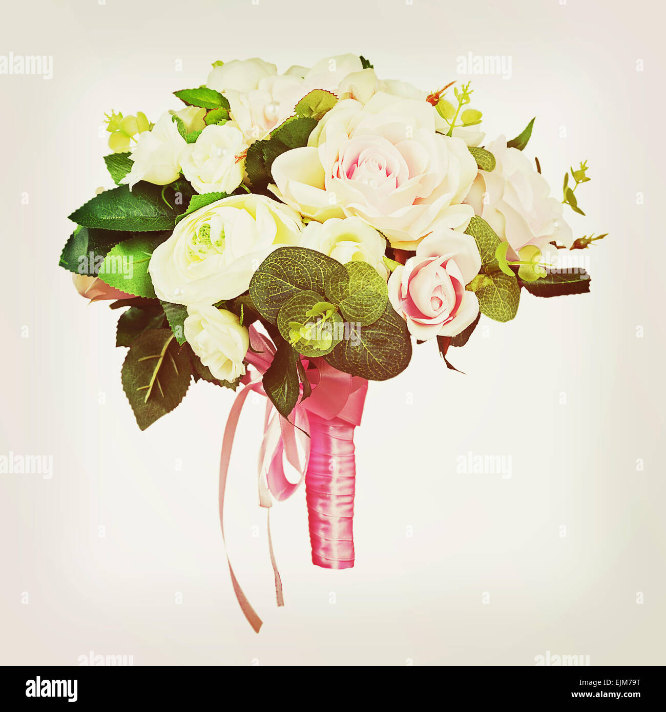 Beautiful wedding bouquet from white and pink roses with retro filter effect. Closeup. Stock Photo