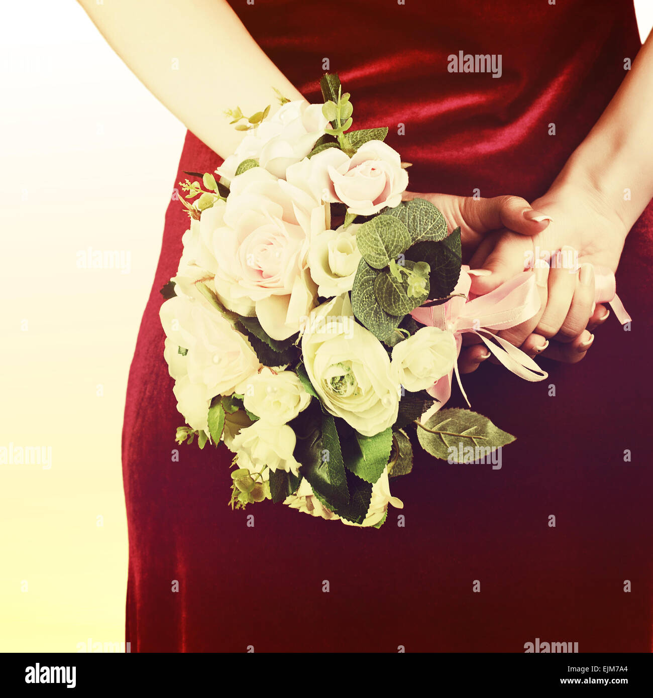 Beautiful wedding bouquet from white and pink roses in hands of bride ...