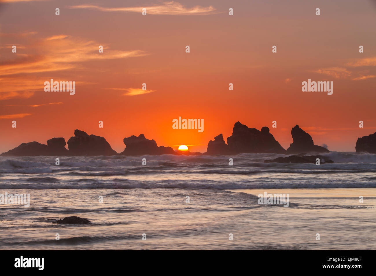 Sunset over Cat and Kitten Rocks, sea stacks at Bandon Beach along the Oregon coast, Oregon, USA. Stock Photo