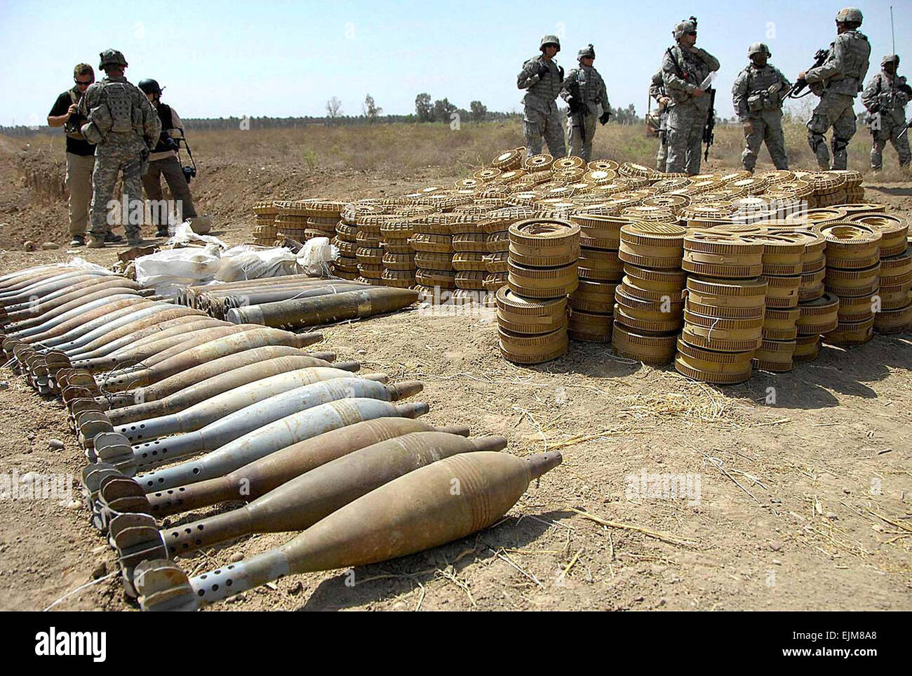 Iraqi National Police and U.S. Army soldiers transport seized weapons to Command Outpost Cashe April 13, 2008 near Abu Thayla, Iraq. Stock Photo