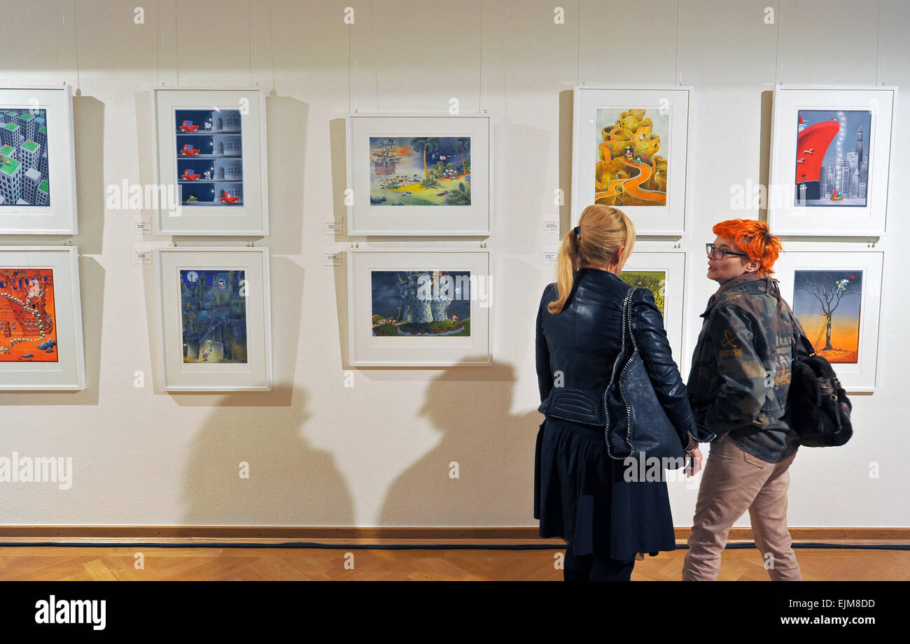 Dresden, Germany. 29th Mar, 2015. Two women look at work by Argentine artist Guillermo Mordillo in an exhibition featuring 102 of his original prints in the Taschenbergpalais in Dresden, Germany, 29 March 2015. The exhibition can be seen in the house chapel until 12 April 2015. Photo: MATTHIAS HIEKEL/dpa/Alamy Live News Stock Photo