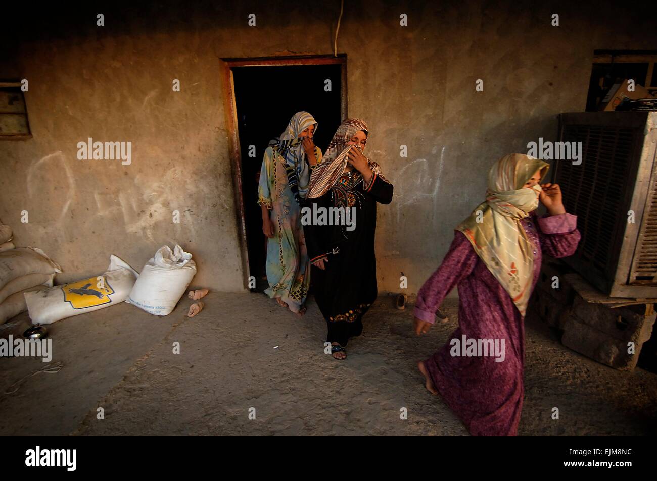 Iraqi women file out of their house after being searched by female US Army soldiers during a cordon search August 6, 2008 February 22, 2007 in Mushada, Iraq. Stock Photo