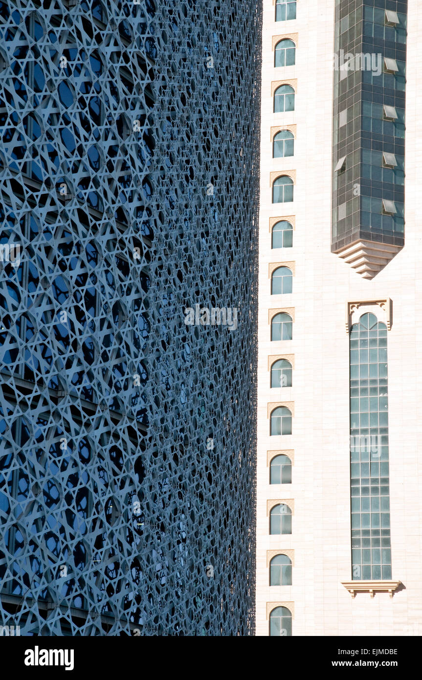 A close-up of the exterior design of the Doha Tower side-by-side with a neighbouring building in the city of Doha, Qatar. Stock Photo