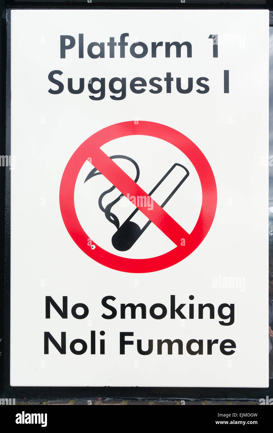 A bilingual no smoking sign in English and Latin at Wallsend Metro station Newcastle north east England UK Stock Photo
