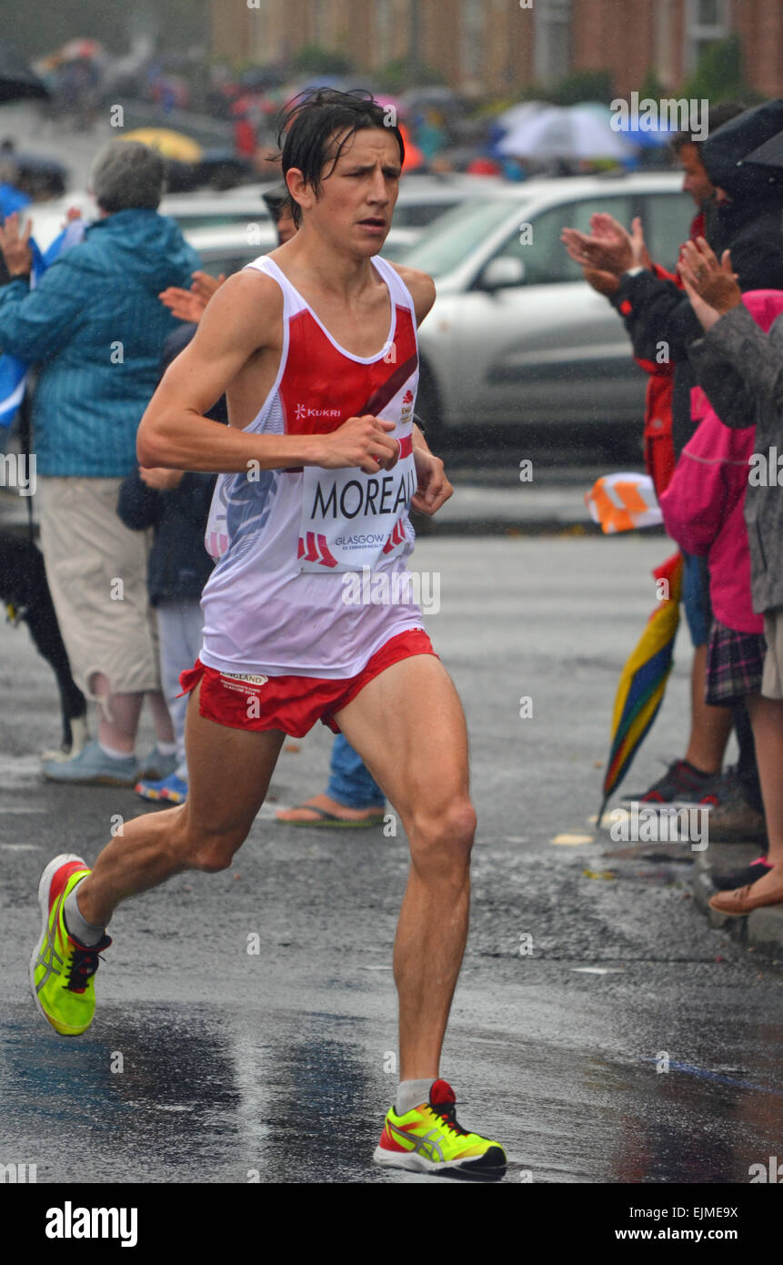 Ben Moreau (England) running the men's marathon at the Glasgow Commonwealth Games 2014 Stock Photo