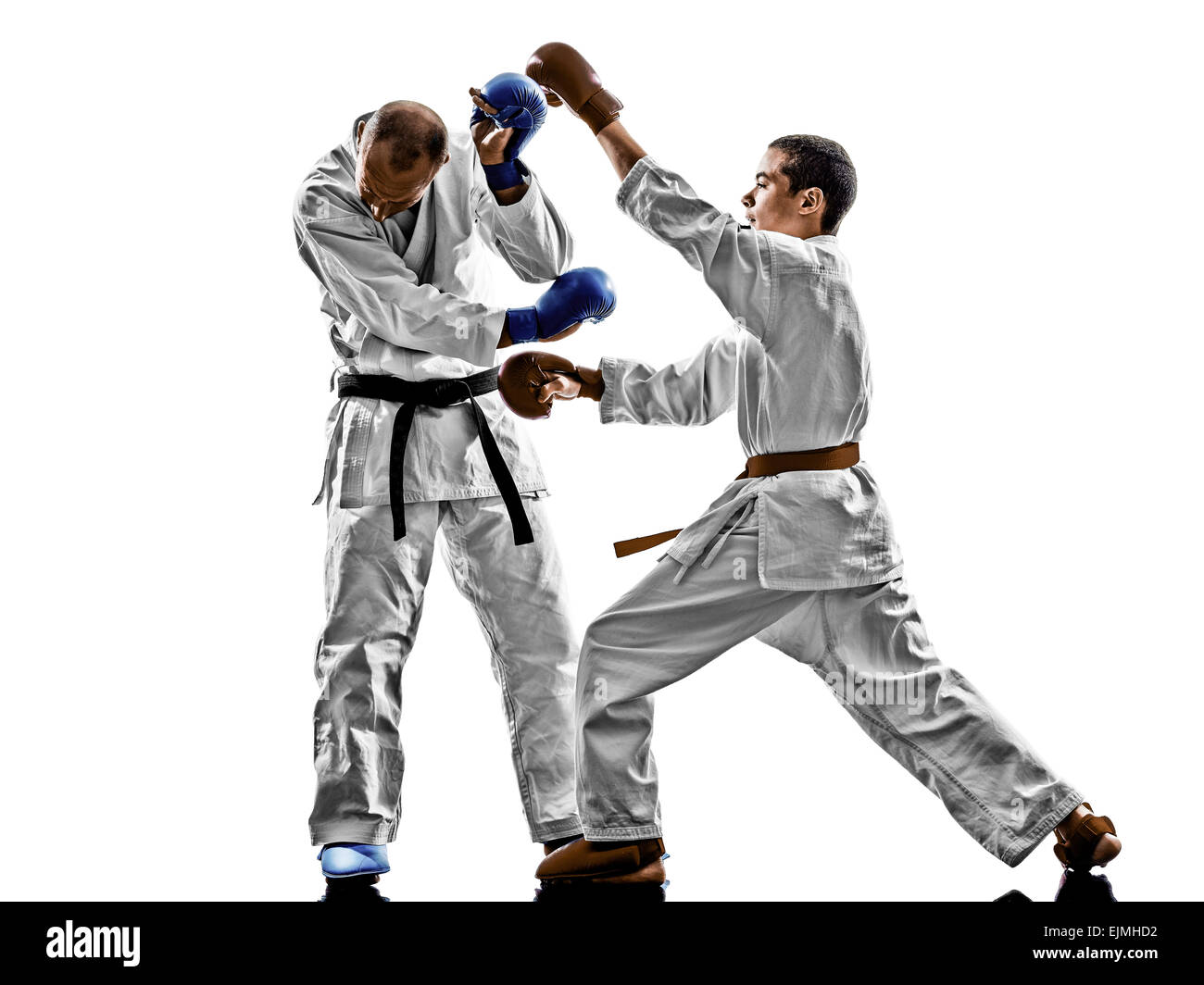 two karate men sensei and teenager student fighters fighting protections isolated on white background Stock Photo