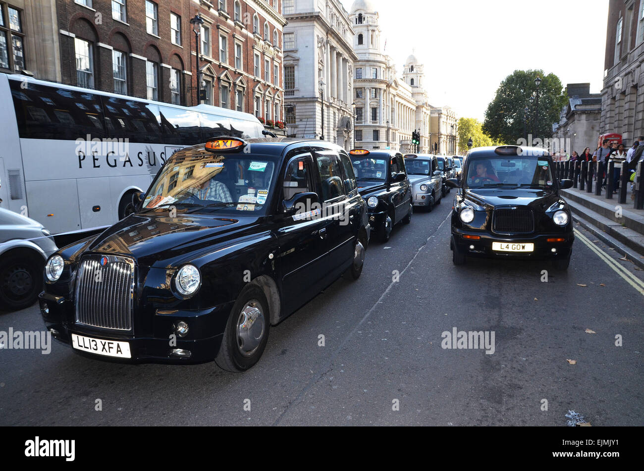Taxi drivers during a mass slow-driving demonstration in central London ...