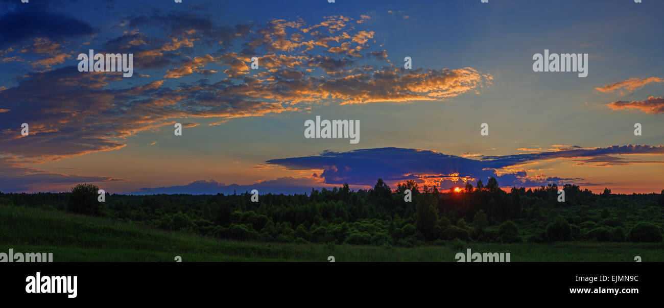 Cloudy sunset - rural landscape Stock Photo - Alamy