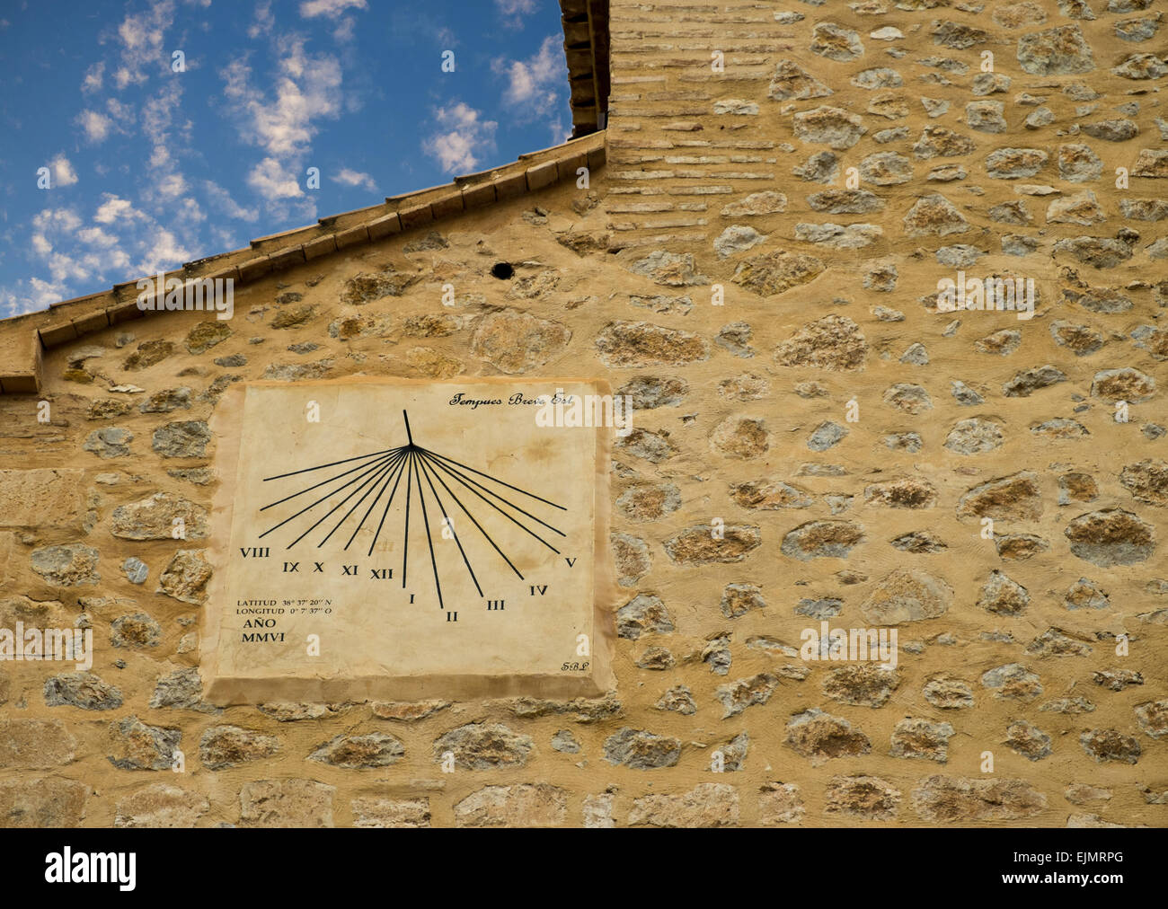Old sun clock on a large stone wall Stock Photo Alamy