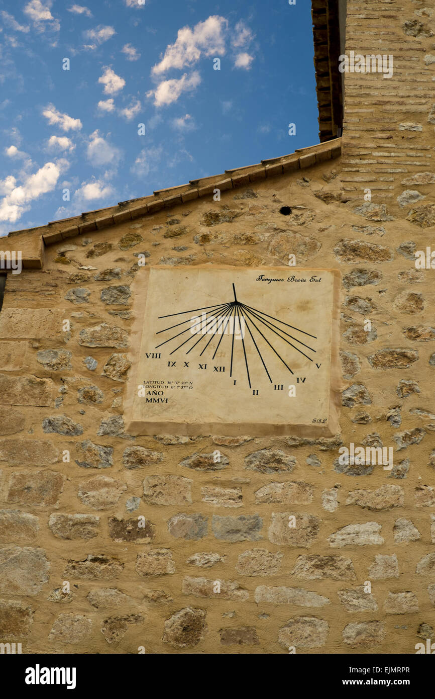 Old sun clock on a large stone wall Stock Photo Alamy