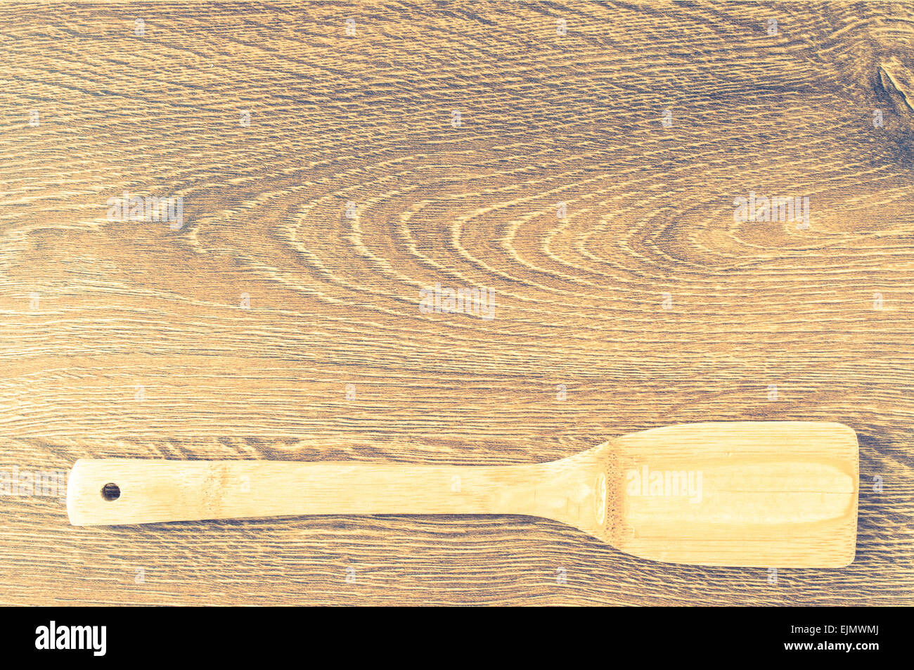 Wooden surface with a a wooden spatula for background Stock Photo