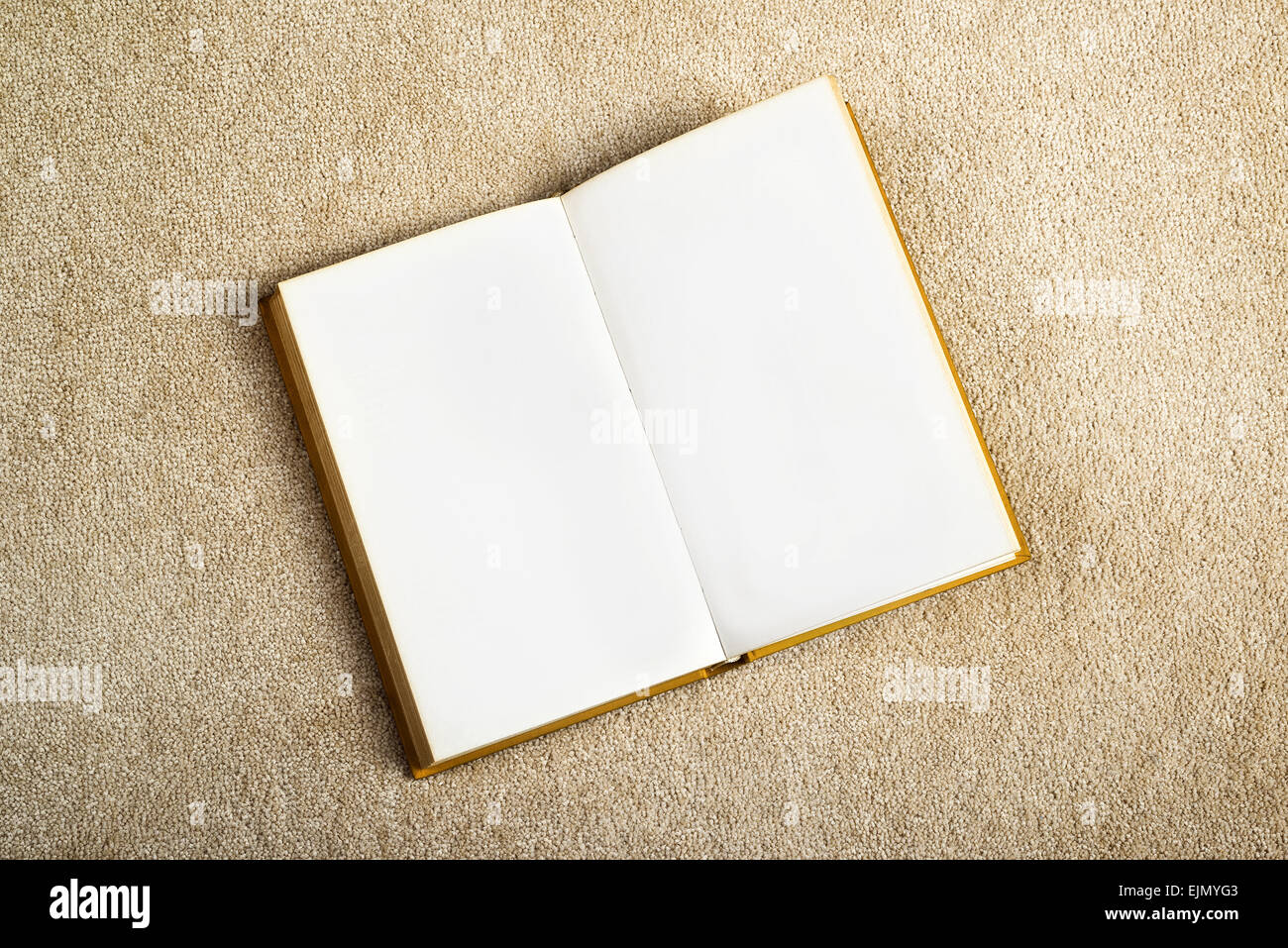 Vintage Book with Blank Pages as Copy Space on the New Beige Carpet Floor Stock Photo
