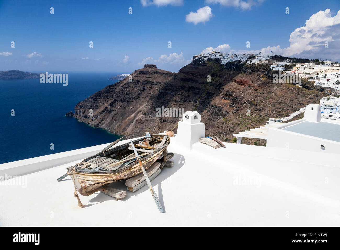 Old row boat on the roof of a building over looking the caldera, Firostefani, Santorini (Thera), Greece Stock Photo
